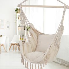 a hammock chair hanging in a living room