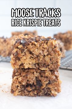 two pieces of granola are stacked on top of each other with the words, moose tracks rice krispie treats