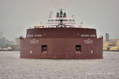 a large boat floating on top of a body of water