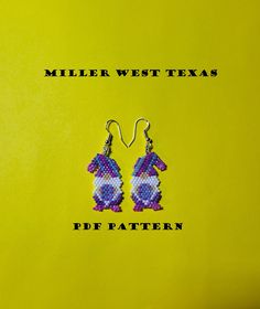 a pair of beaded earrings with the words miller west texas on each earring