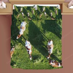 cows are laying down on the grass in this aerial photo