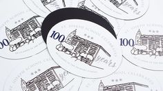 several stickers with the words 100 years on them are shown in black and white