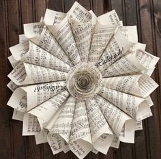 a paper flower made out of sheet music