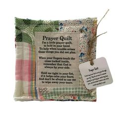 a prayer pillow with a tag on it