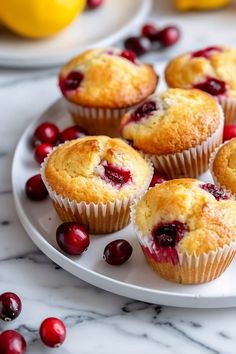 several cranberry muffins on a white plate