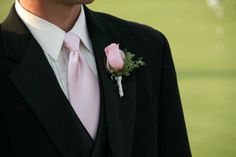 Pink rose boutonniere, silver wrapped, pink and black wedding Black Suit With Pink Accents, Pink And Black Suit, Black Suit Pink Tie, Black Suit With Pink Tie, Black Tuxedo With Pink Bow Tie, Groom Black Suit Pink Tie, Black Tux Pink Bow Tie