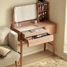 a small wooden desk with a mirror on it