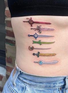 a woman's stomach with many different types of swords on it