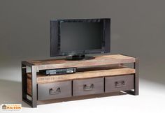 an entertainment center with drawers and a flat screen tv on it's sideboard