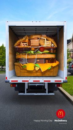 the back end of a moving truck filled with furniture