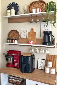 kitchen shelves with pots, pans and other items on them