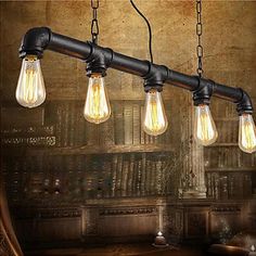 three light bulbs are hanging from the ceiling in an old - fashioned room with bookshelves