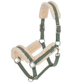 a bridle with sheepskins on it