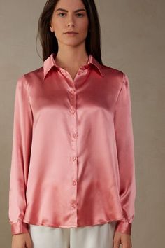 Long sleeve shirt in pure silk with collar and buttons up the middle. Back box pleat for a draped, loose fit. Buttoned cuffs and rounded hem.
The model is 5’ 9” (175 cm) tall and is wearing a size S.

The silk in this piece is bluesign® certified. Chic Daywear Shirt With Covered Buttons, Chic Shirt With Covered Buttons For Daywear, Chic Silk Shirt For Semi-formal Occasions, Silk Semi-formal Tops, Chic Long Sleeve Shirt With Covered Buttons, Classic Silk Tops With Lapel Collar, Chic Collared Shirt With Covered Buttons, Elegant Shirt With Covered Buttons For Spring, Casual Satin Tops For Daywear