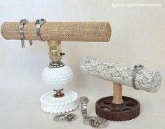 an old fashioned telescope is sitting on top of a stand with other items around it