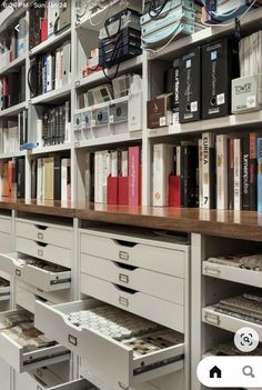 the shelves are full of books and files