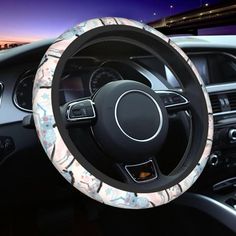 the steering wheel cover is decorated with flowers