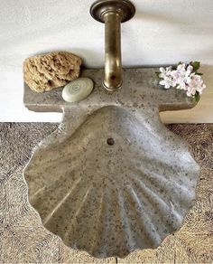 a bathroom sink sitting on top of a tiled floor