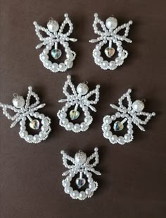 six pieces of beaded broochies on a table