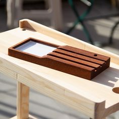 a wooden tray sitting on top of a table