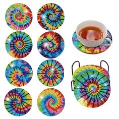 six coasters and a cup of tea on a white background with colorful spiral designs