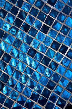 blue glass mosaic tiles in the shape of squares