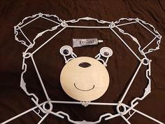 a paper cut out of a bear with chains around it