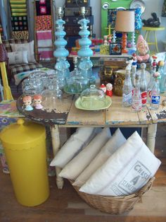 the table is covered with glass bottles and other items