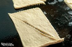 four pieces of flat bread sitting on top of a pan