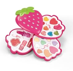 two strawberry shaped boxes filled with different types of makeup