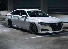 a white car parked in a parking lot