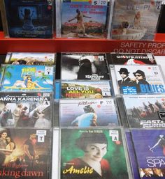 many dvds are on display for sale in a store or at the same time as other movies