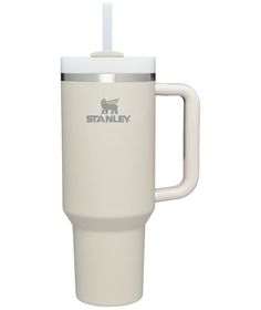 the stanley travel mug is white and has a stainless steel lid with a plastic handle