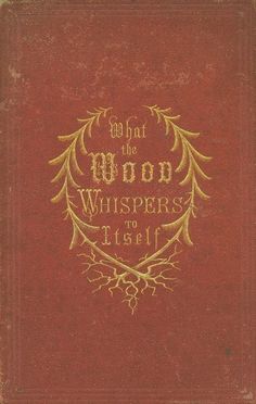 an old red book with gold lettering on the front and back cover that says, what the wood whispers tell