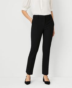 Elevate your office wardrobe with the Ann Taylor Petite Ankle Pant in Bi-Stretch, tailored to perfection for a sleek and sophisticated look. These pants are designed to flatter with a slim leg that gracefully hits at the ankle, ensuring a polished silhouette from morning meetings to evening engagements.

- **Size:** Petite 2
- **Color:** Classic Black
- **Material:** 66% Polyester, 28% Rayon, 6% Spandex
- **Fit:** Regular fit, lean through the hip and thigh
- **Rise:** Mid-rise, sits 2 1/4" belo Lean Legs, Office Wardrobe, Knitted Suit, Wear To Work, Ankle Pants, Polished Look, Slim Legs, Cropped Pants, Effortless Style