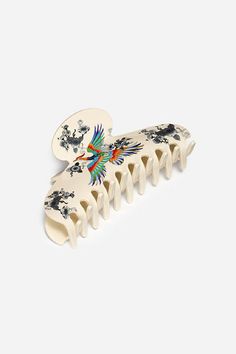 Offering a statement piece that combines sophistication with whimsical charm, the Dreamer Garden Hair Clip adds a splash of color to your overall look. Featuring a beautiful depiction of a tropical bird in flight, this sturdy clip is perfect for daily use. Add to your handbag for easy access at a moment's notice. Johnny Was Women's Dreamer Garden Hairclip in Dreamer Ivory White Bird In Flight, Tropical Bird, Fashion Sites, Boho Chic Outfits, Tropical Birds, Embroidered Jeans, In Flight, Johnny Was, Ivory White