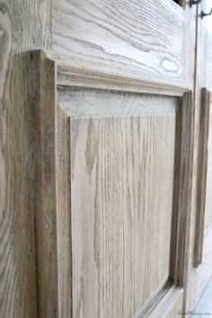 a close up view of a wooden cabinet door