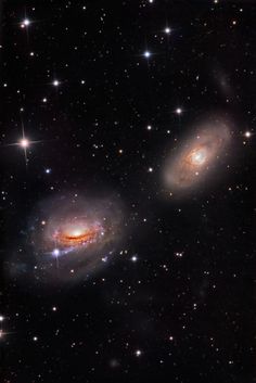 two spiral galaxy like objects in the sky