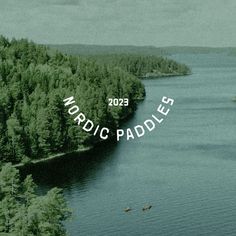 an aerial view of a lake surrounded by trees with the words nordic paddles over it