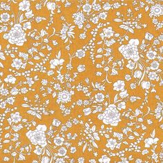 an orange and white flowered background with small flowers on the bottom half of it