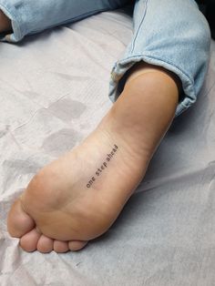 a person with a small tattoo on their foot