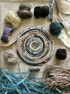 several balls of yarn are laid out on a table