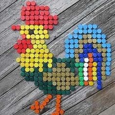 an image of a chicken made out of legos on a wooden surface with the word chick spelled in multicolored letters