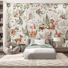 a bedroom with a bed and wallpaper that has animals on it