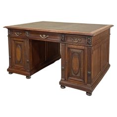 an old wooden desk with two drawers on each side and one drawer at the top