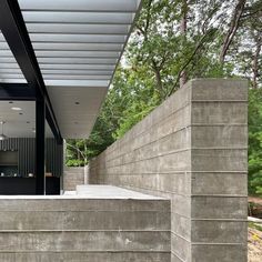 an outdoor area with concrete steps leading up to a kitchen and living room in the background