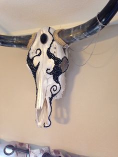 a cow's skull hanging from the ceiling