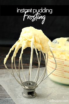 a whisk is being used to mix ingredients in a mixing bowl