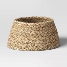 a large woven basket on a white background