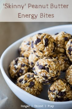 a bowl filled with oatmeal chocolate chip energy bites on top of a table